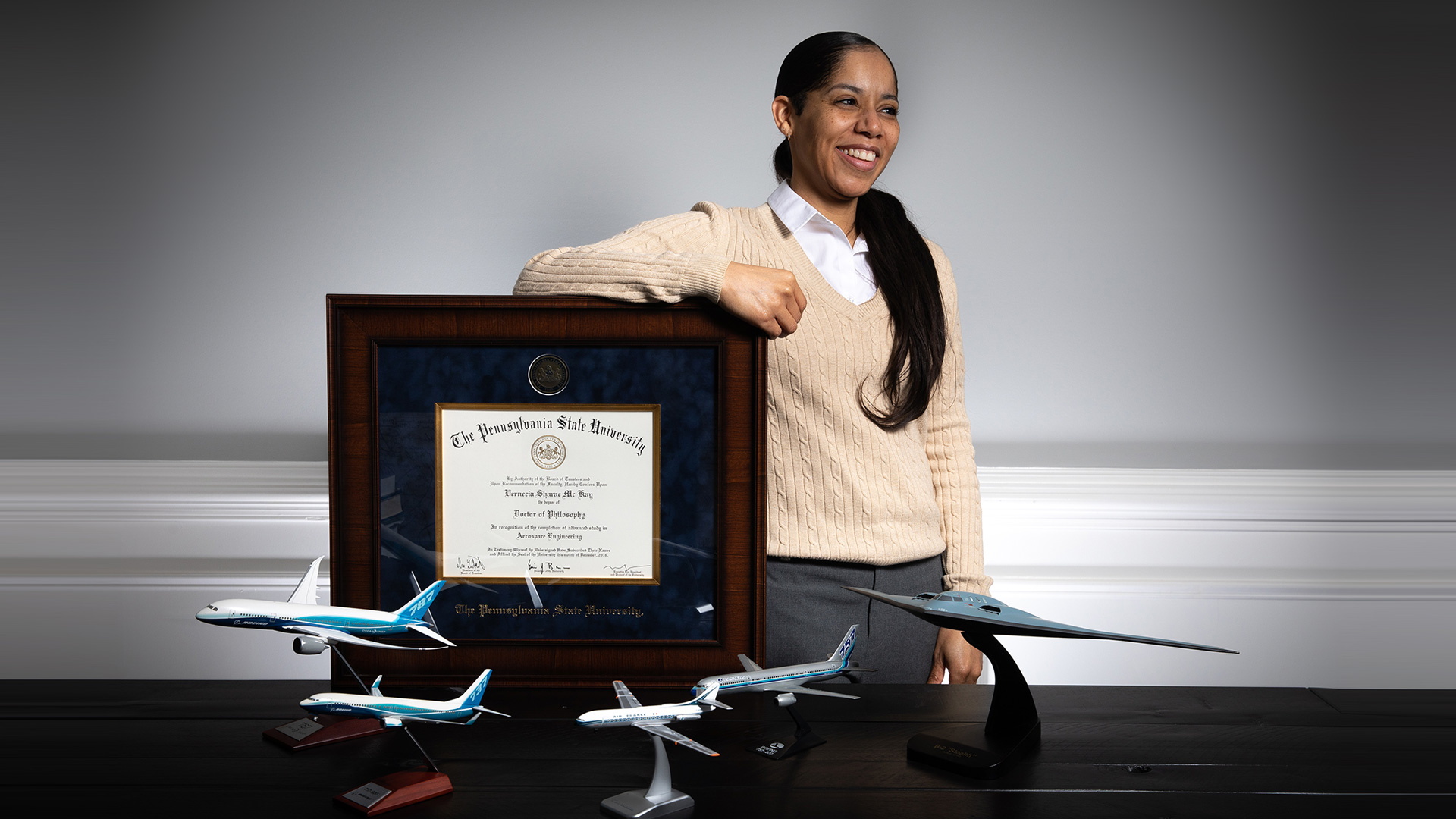 Sharaé Meredith poses with her doctoral diploma from Penn State.