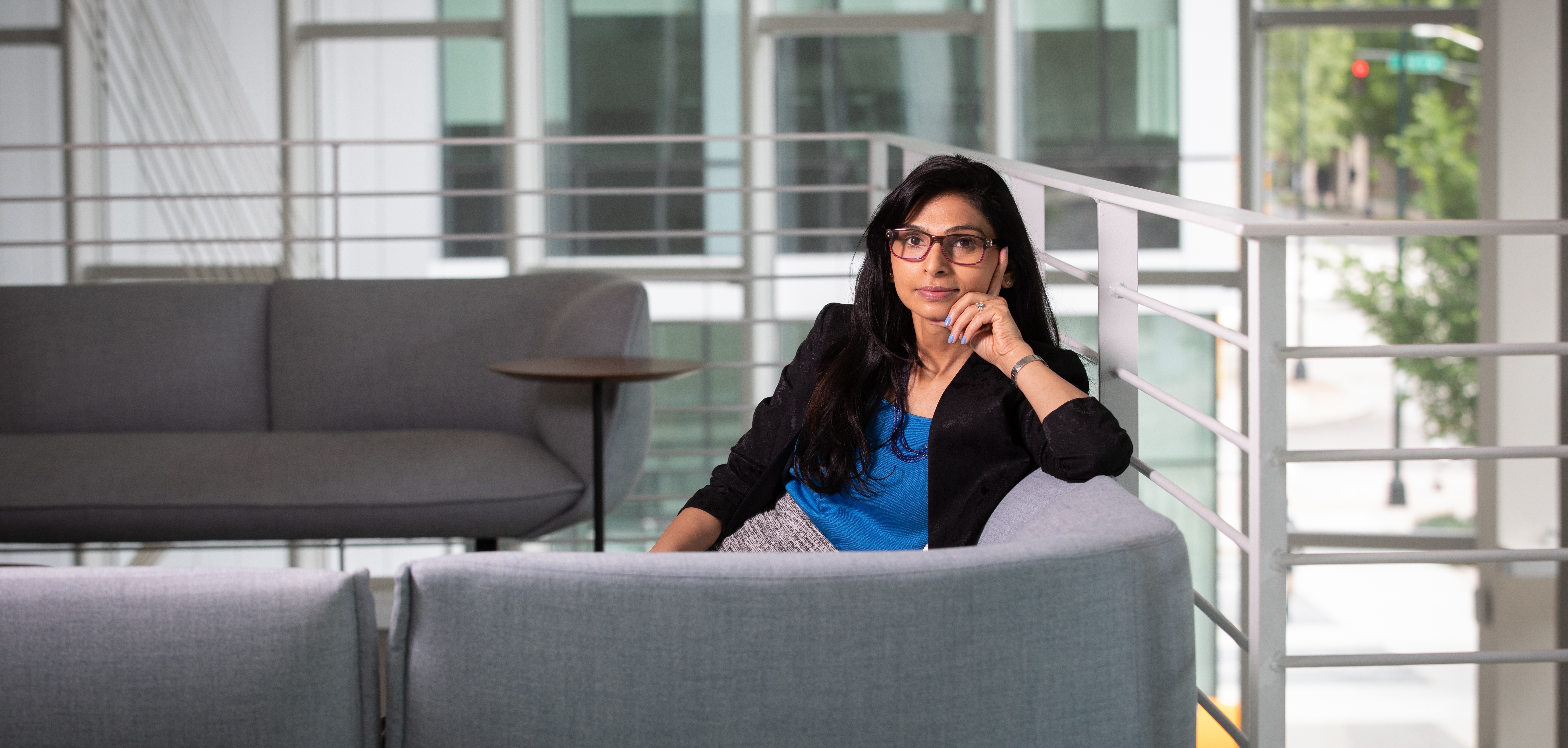 Gayatri Shah, a senior research engineer at Georgia Tech Research Institute's (GTRI) Project Management Support Office (PMSO), poses in the Coda building. (Credit: Branden Camp) 