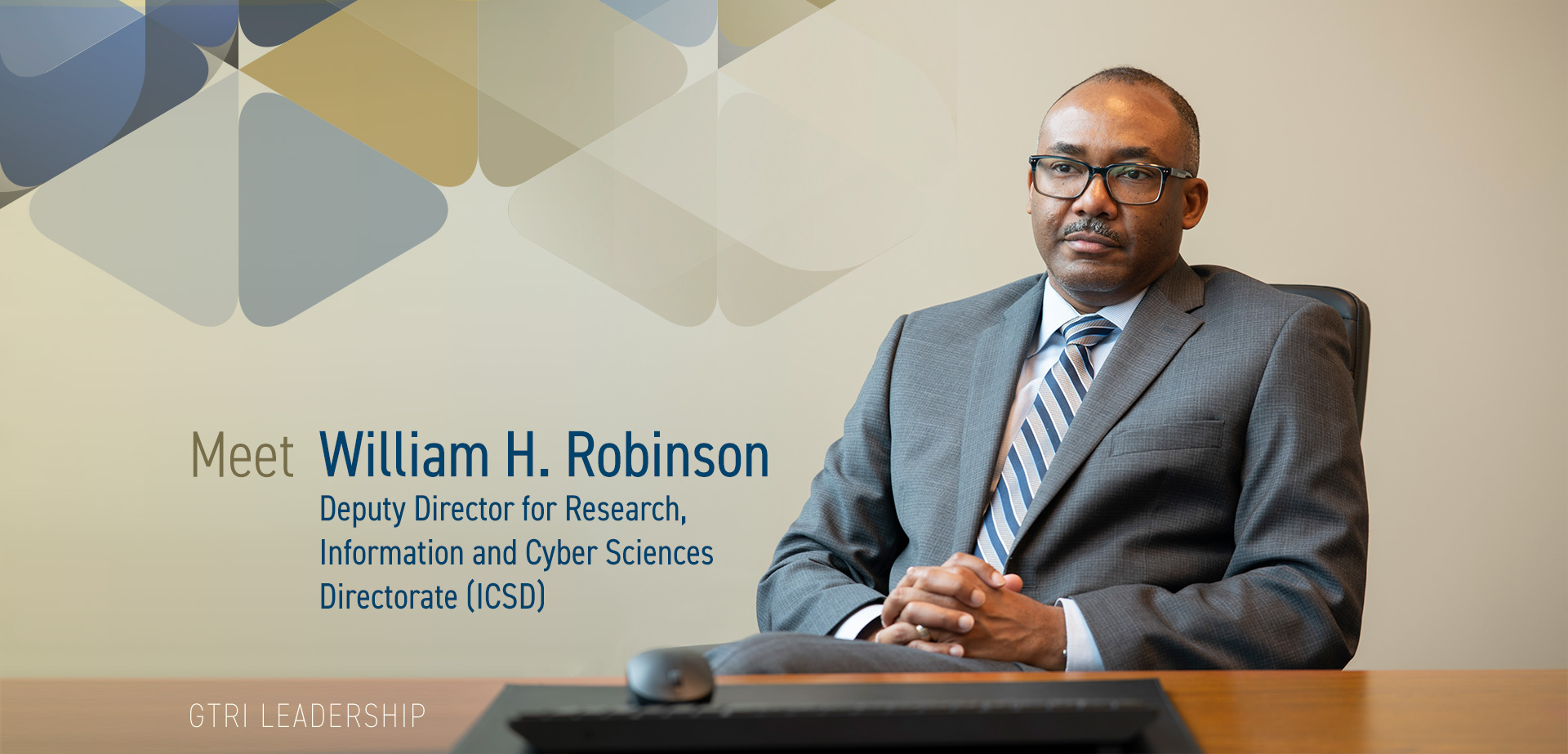 Photo of William H. Robinson sitting behind desk with text that reads: Meet William H. Robinson  Deputy Director for Research for  Information and Cyber Sciences  Directorate (ICSD)