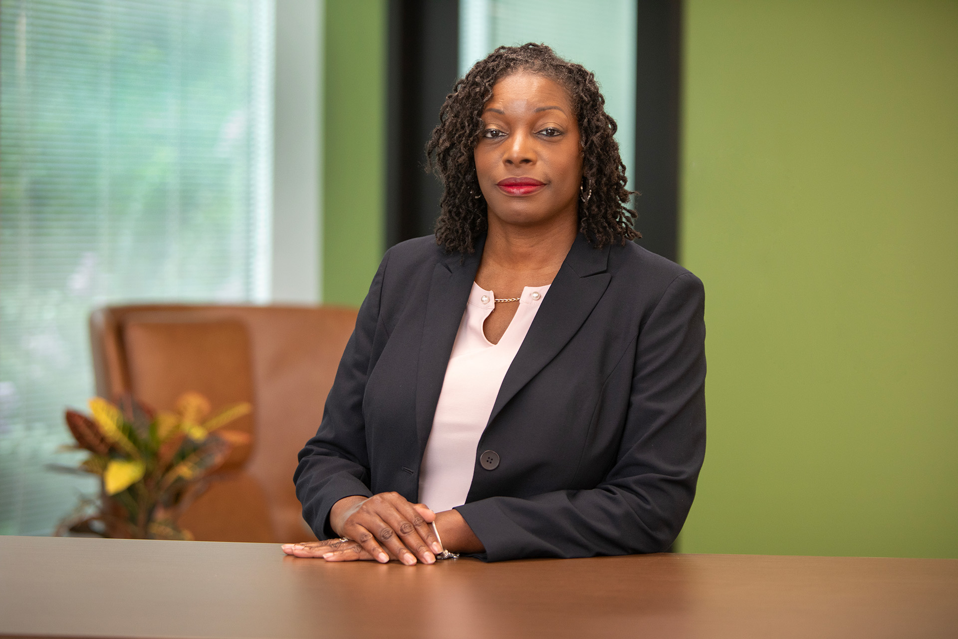 Renee Gourdine sitting at a desk. (Photo: Christopher Moore)