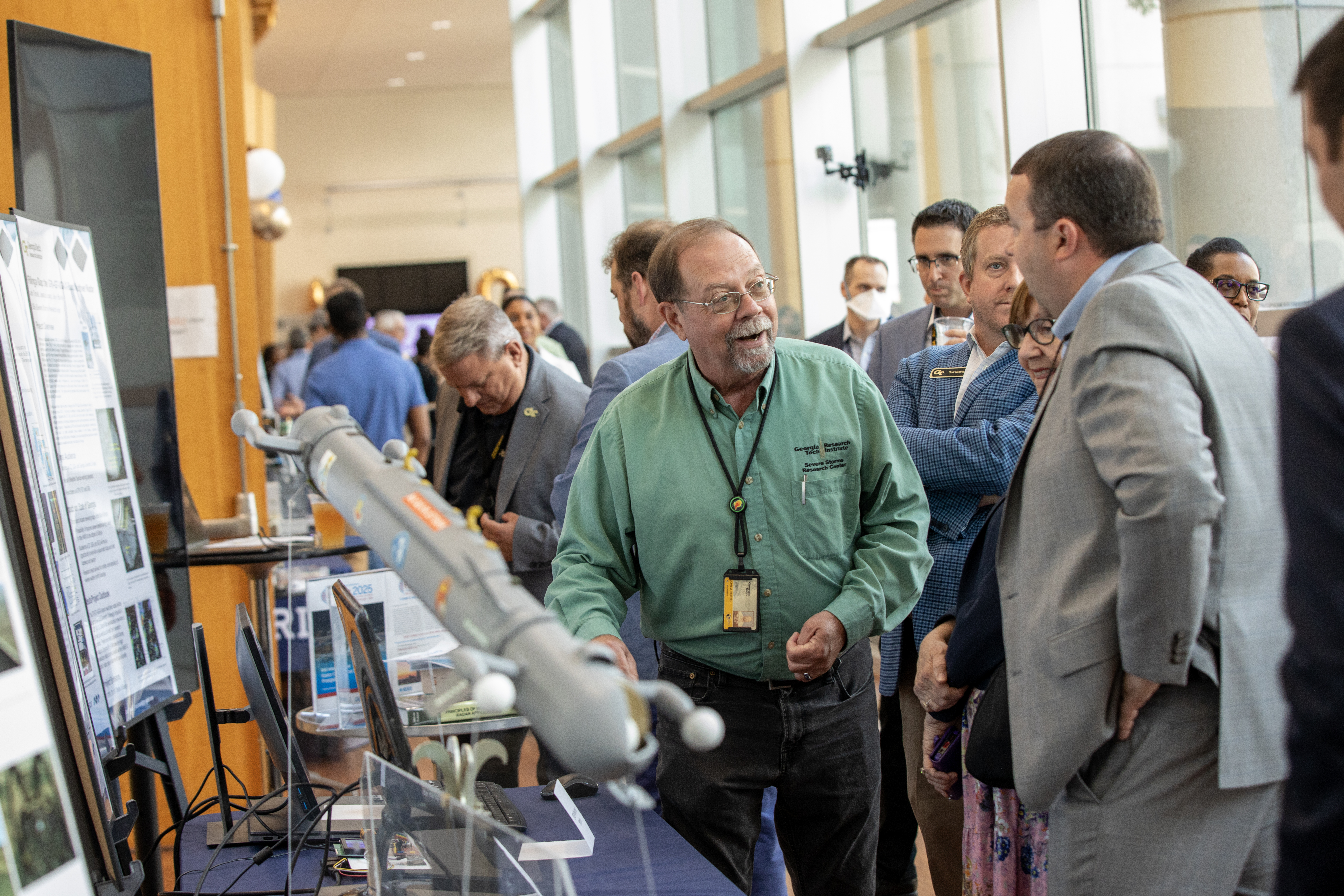 John Trostel of the GTRI Severe Storms Research Center (SSRC) chats with attendees.