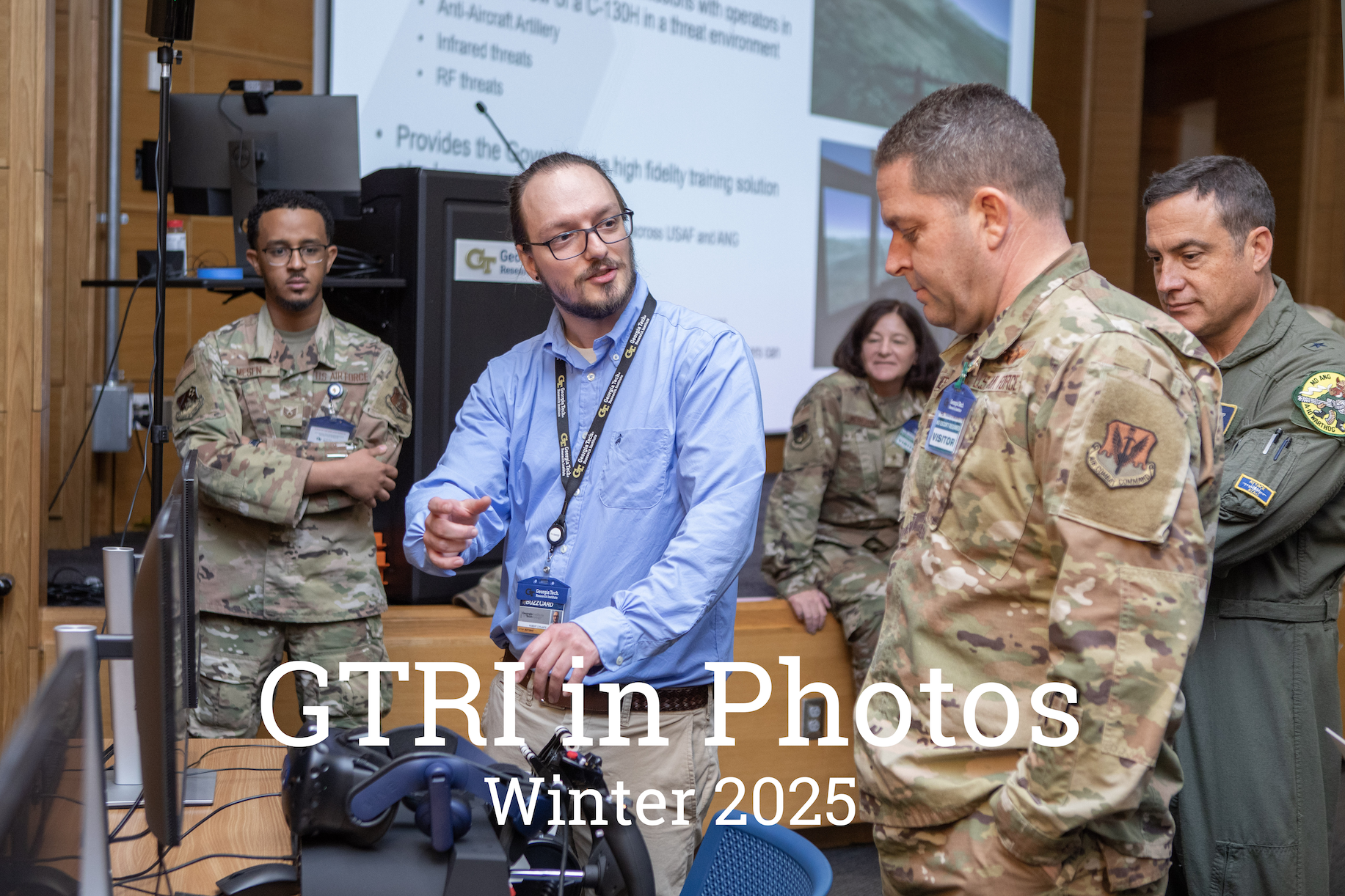 Engineer and soldiers in uniform looking at technology