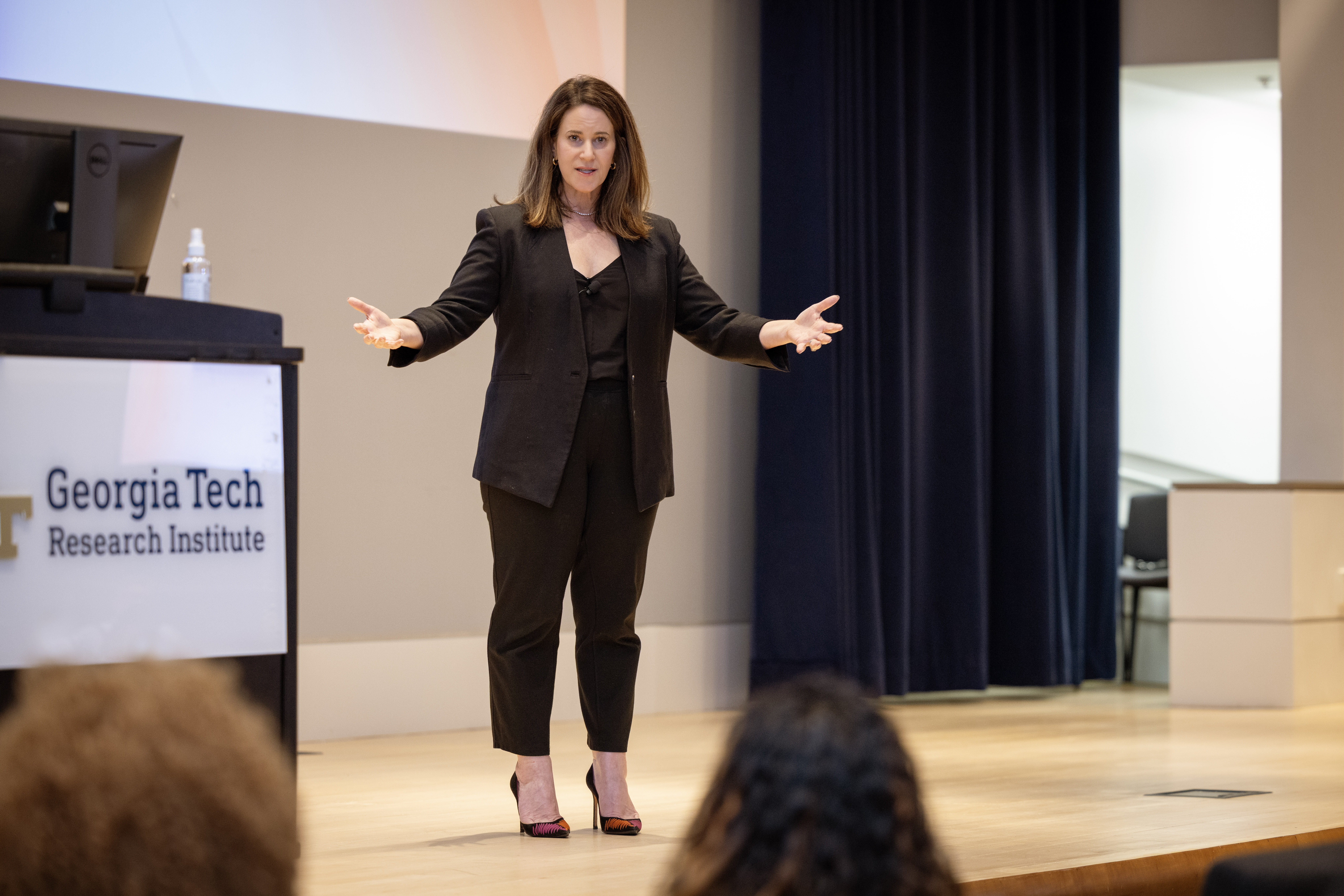 Jennifer Kattula, Microsoft Advertising CMO, delivers keynote speech with open arms at The Future is HER conference at GTRI.