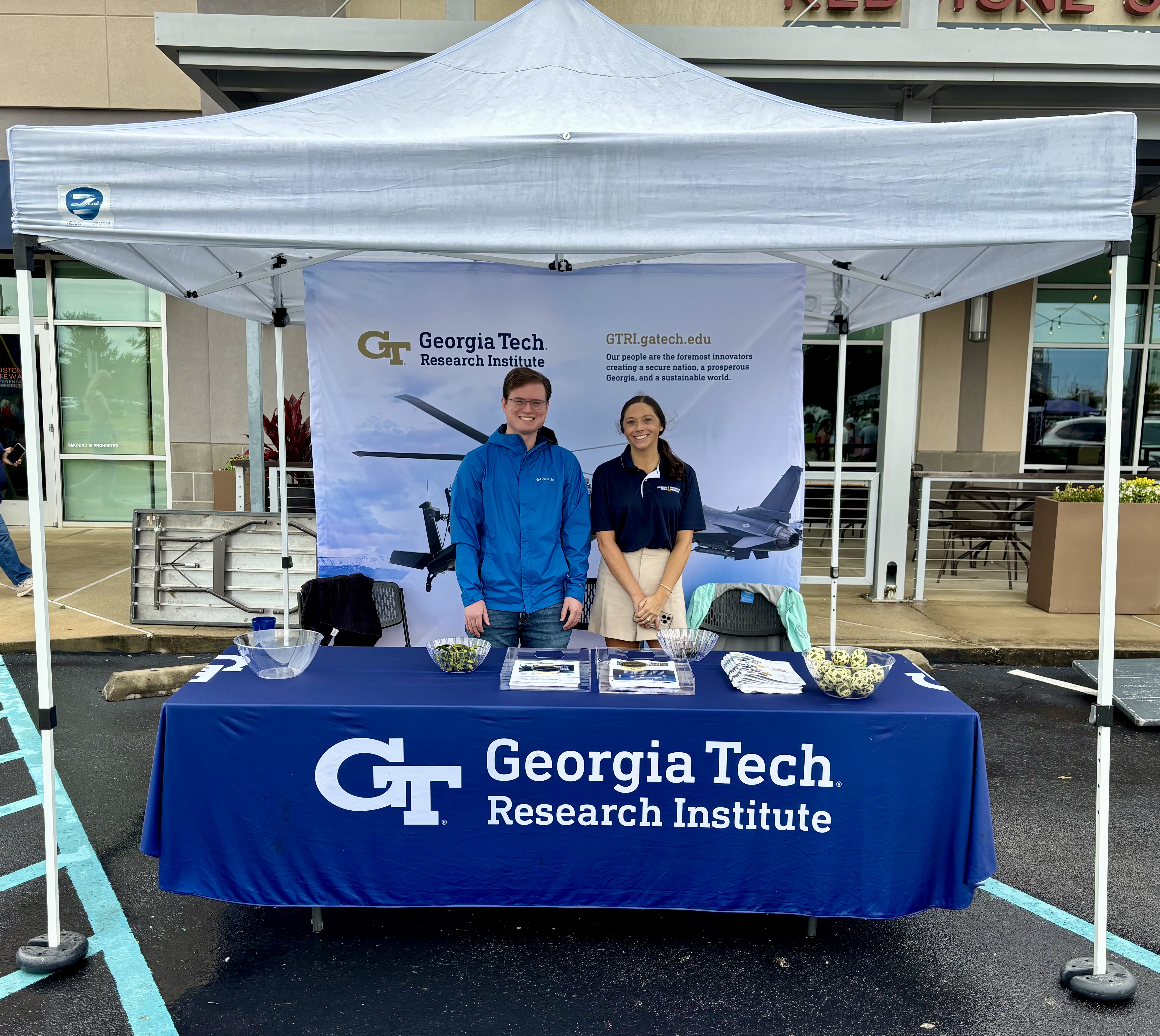 Ian Slamen and Morgan McBride welcome attendees to the GTRI booth.