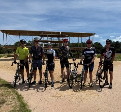 GTRI bikers get ready to race in front of old plane