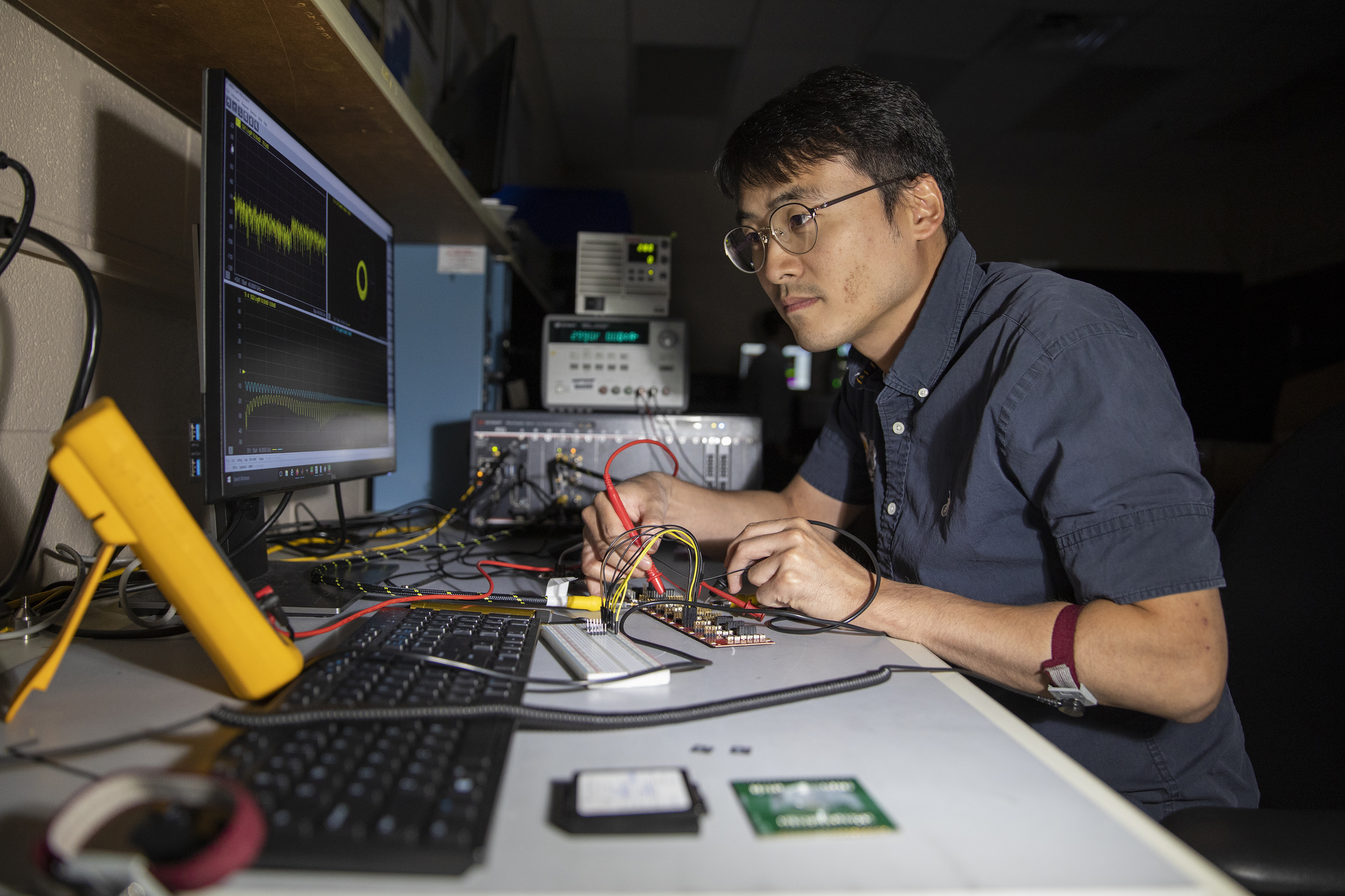 Researcher Paul Jo checks RF test board