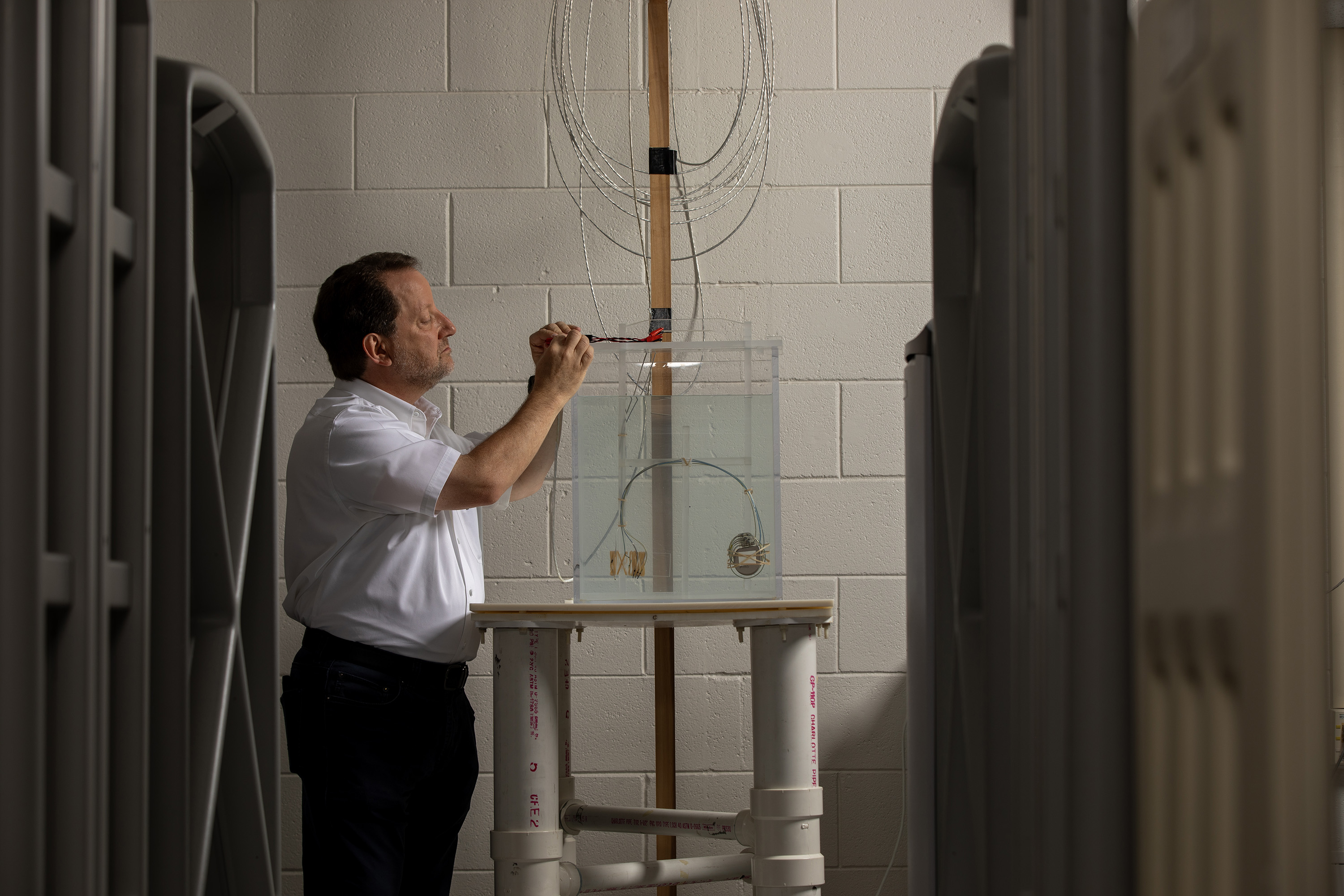 Security and logistical systems surround a cart containing a medical device under test.