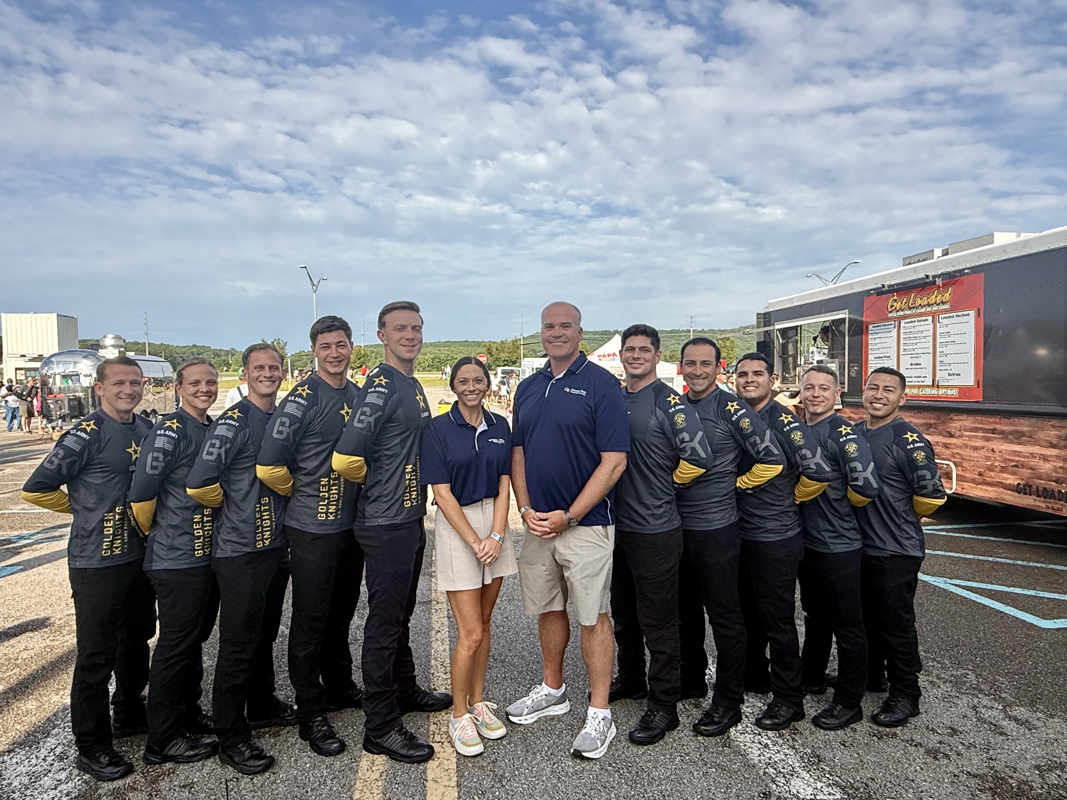 Morgan McBride and Paddy Heiliger pose with the U.S. Army Parachute Team ("The Golden Knights").