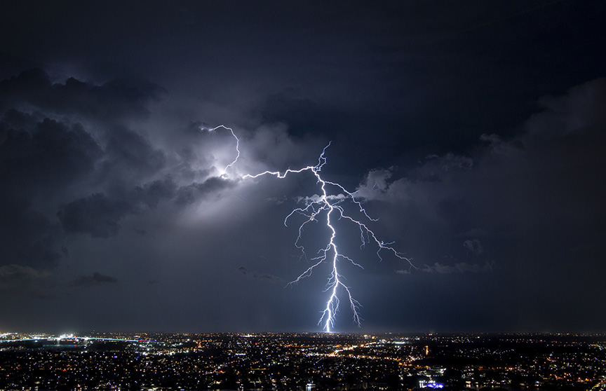 Lightning strikes the ground in a city