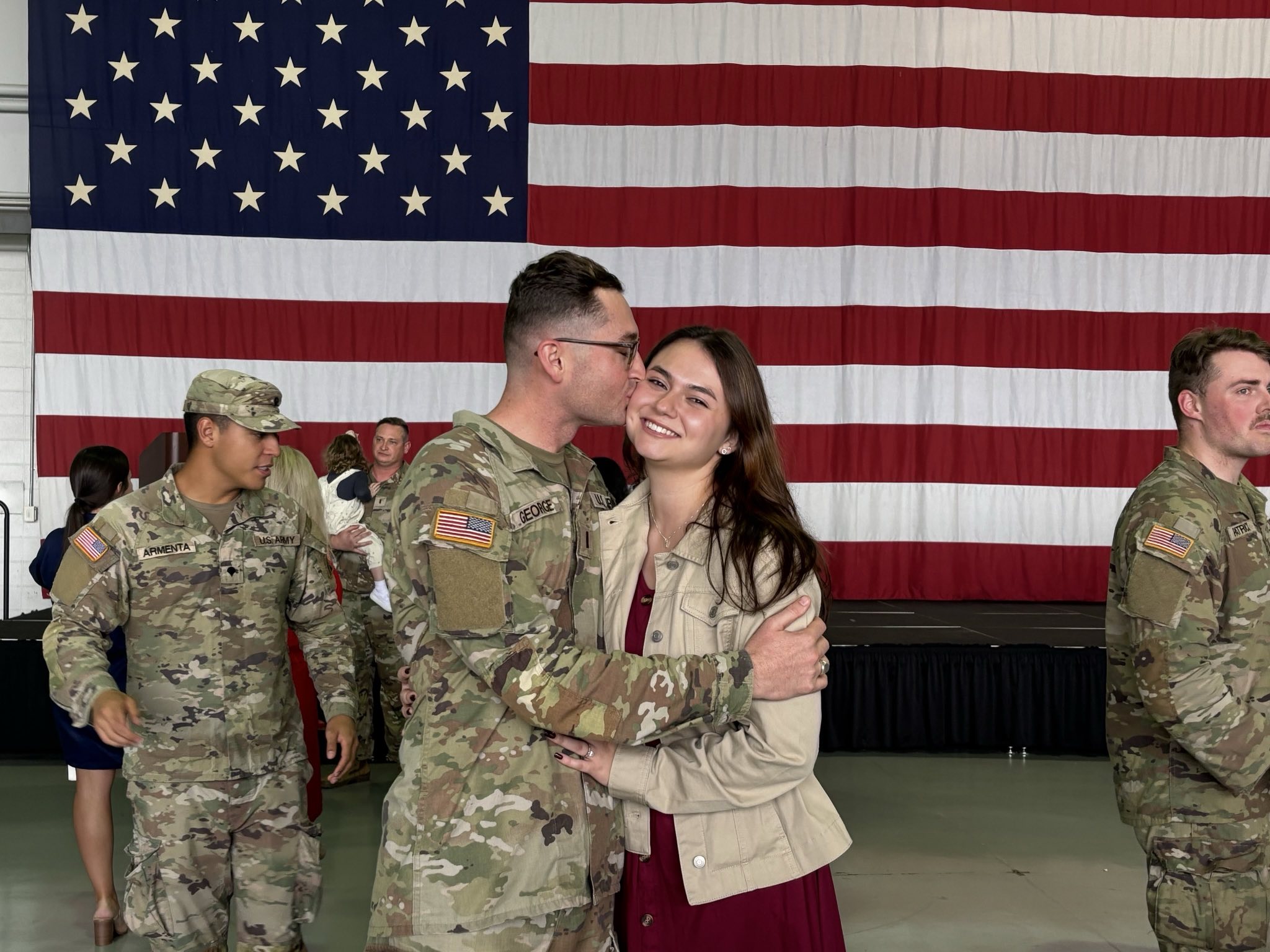 Keegan George, with his wife, Katie Munson at ARB Dobbins, GA hanger. Taken when our families welcomed the 48th Brigade home off the plane from Kosovo.