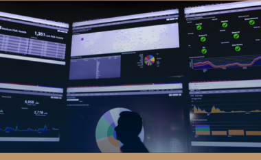 six monitors of information with person in front