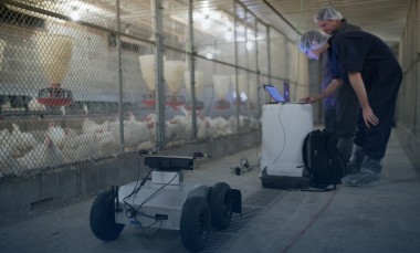 GTRI-research-scientist-Colin-Usher-and-co-op-student-Thomas-Wyatt-prepare-a-robot-for-testing-in-a-grow-out-house-used-to-raise-chickens-photo-credit-Branden-Camp-Georgia-Tech-Research-Institute