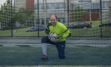 The goalie poses with a soccer ball. (Photo Credit: Christopher Moore)