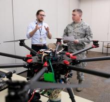 two researchers with UAV
