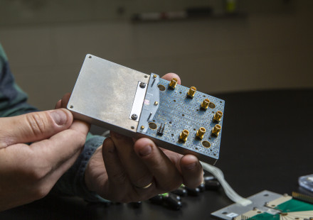 A GTRI researcher working on an RF photonics project.  