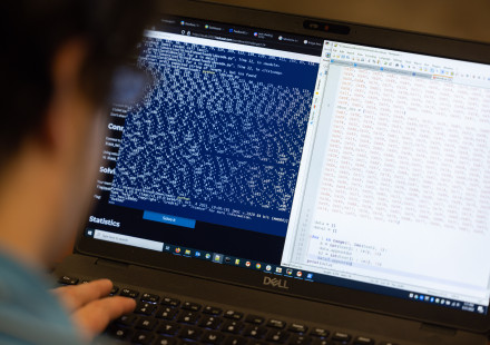 A photo of a researcher participating in a hackathon/CTF event at GTRI.