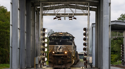 photo of train passing through portal structure