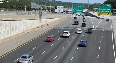 Southbound traffic moving on Interstate 75 in Cobb County. An entrance ramp for the high-occupancy vehicle lane is in the background.