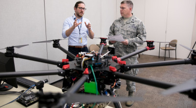 two researchers with UAV
