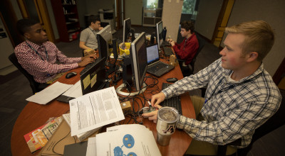 Four-high-school-summer-interns-work-on-the-Senior-In-Home-Artificial-Intelligence-Assistant-project
