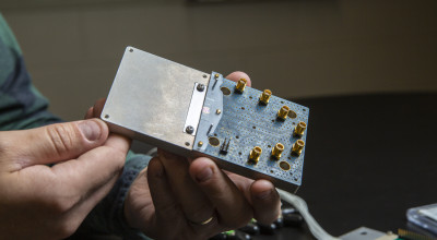 A GTRI researcher working on an RF photonics project.  