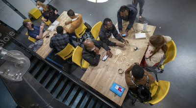 Soldiers, students, and researchers collaborate at a table during the Marne Innovation Workshop. (Photo Credit: Sean McNeil)