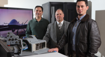 Researchers with prototypes of MQ-9 upgrades