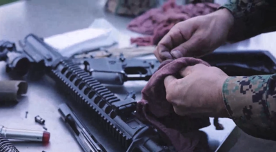 DoW STED--photo of rifle being cleaned with new STED lubricant.