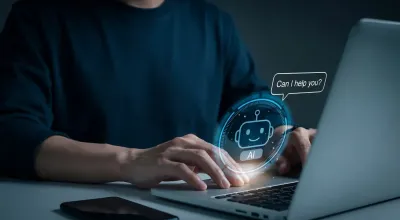 user sitting and typing on a laptop